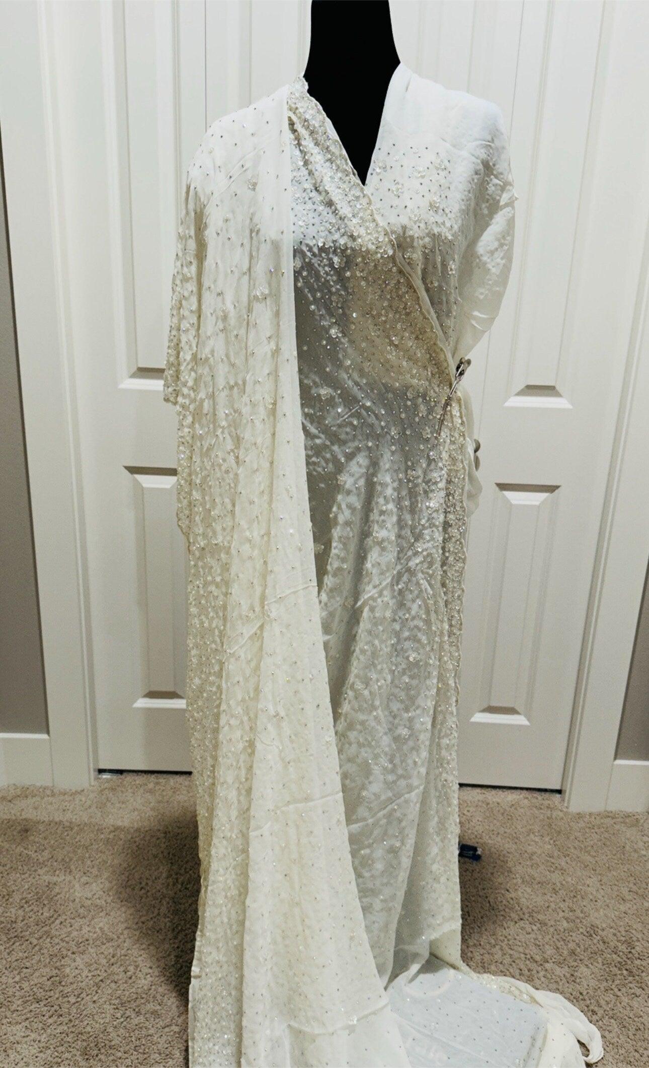 Pure Georgette Hand work Saree in Beige/Cream